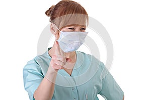 Lady doctor with respirator posing and show finger on you
