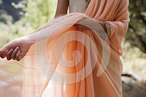 lady draping peach pashmina shawl