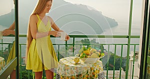 A lady in dress enjoying morning ritual with cup of hot beverage. Surrounding nature adds a serene ambiance to the start