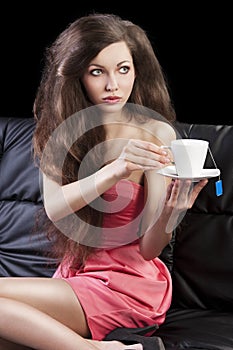 Lady drinkig tea, she take a cup of tea