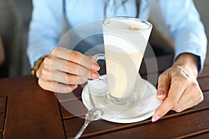 Lady drinking coffee in cafe