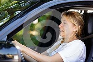 lady driver with fearful expression trying to slow down