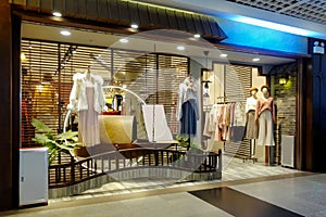 Lady fashion shop window front mannequins photo