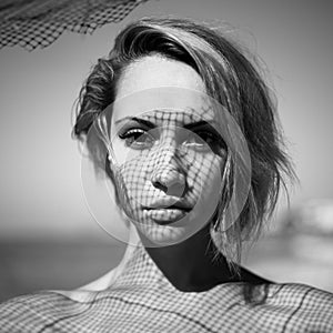 Lady with fishnet pattern on face