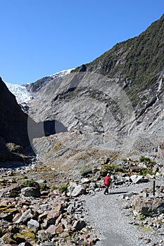 Lady on footpath Franz Josef Glacier New Zealand