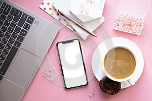 Lady freelancer's home pastel pink workplace, cup of coffee and smartphone mock-up