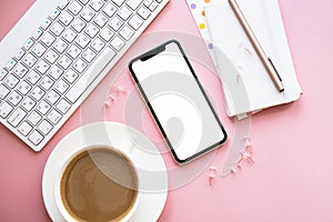 Lady freelancer's home pastel pink workplace, cup of coffee and smartphone mock-up