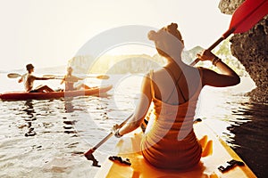 Lady friends walk kayak kayaking sea sunset