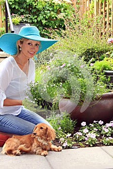 Lady gardener with dog.