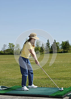 Lady At Golf Driving Range