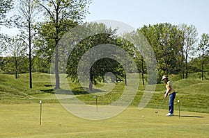 Lady On Golf Practice Green