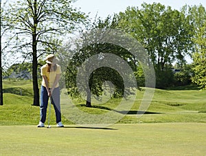 Lady On Golf Putting Green