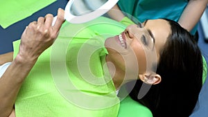 Lady happy with result of dental treatment, professional help cosmetic dentistry