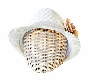 Lady hat on a wickerwork mannequin head isolated on white backgr