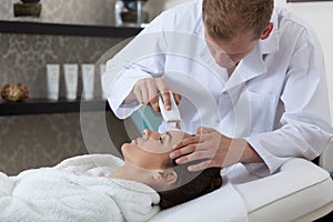 Lady having cavitation peeling in spa photo