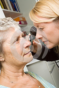 Lady having eye test examination photo