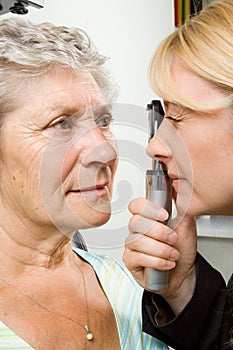 Lady having eye test examination