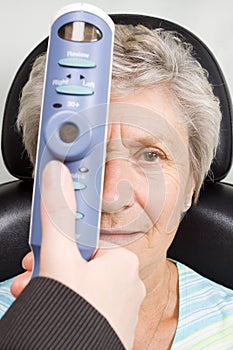 Lady having eye test examination