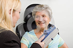 Lady having eye test examination