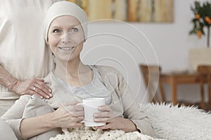 Lady in headscarf with mug