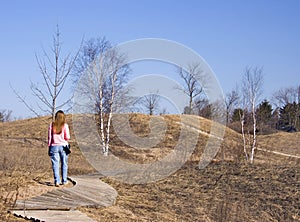 Lady Hiking A Nature Trail