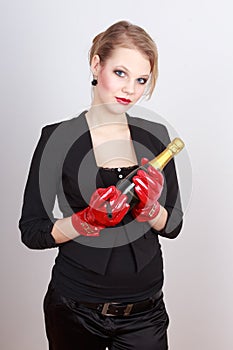 Lady holding a bottle of champagne