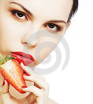 lady holding a juicy strawberry