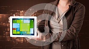 Lady holding tablet with modern software operational system