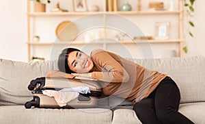 Lady Hugging Suitcase Dreaming About Upcoming Vacation Sitting At Home