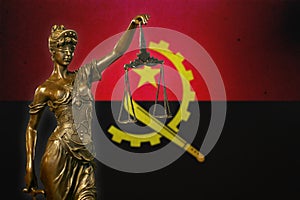 Lady Justice against an Angolan flag