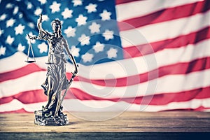 Lady Justice and American flag. Symbol of law and justice with U
