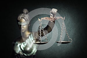 Lady Justice on emerald background photo