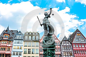 Lady Justice in front of RÃ¶merberg Ostzeile buildings in Frankfurt, Germany