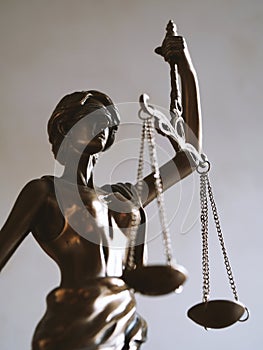 Lady justice or justitia figurine - law and jurisdiction symbol