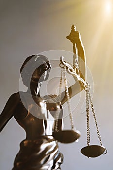 Lady justice or justitia figurine law and legal symbol