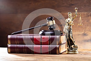 Lady Justice Near Gavel Over Law Book
