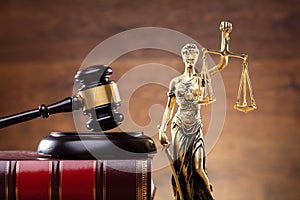 Lady Justice Near Gavel Over Law Book