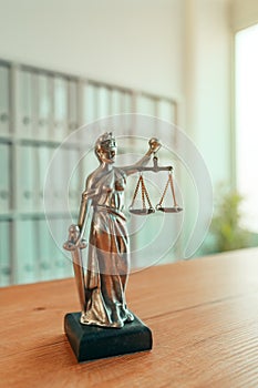 Lady Justice statue in law firm office