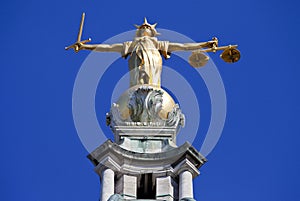 Lady Justice Statue ontop of the Old Bailey in London photo