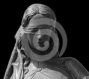 Lady justice or Themis Symbol of justice isolated on black background. Close-up of lady justice statue with blindfold