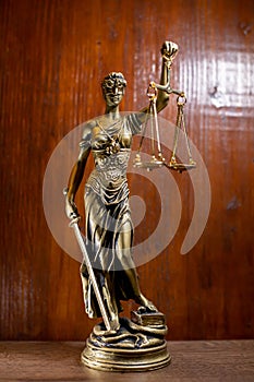lady justice on wooden background