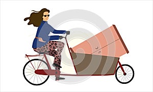 Lady in leopard leggins on cargo bike bakfiets delivering a large object wardrobe.