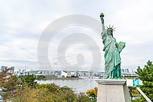 Lady liberty juxtaposed against Rainbow Bridge in Tokyo.