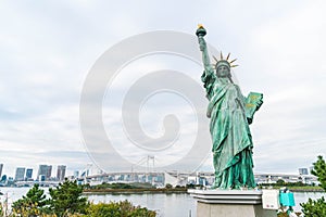 Lady liberty juxtaposed against Rainbow Bridge in Tokyo.