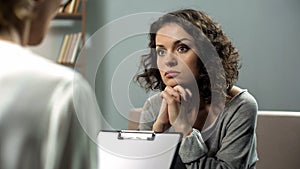 Lady listening attentively to her psychotherapist advice, mental health, hope photo