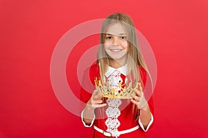 Lady little princess. Girl cute smile hold crown while stand red background. Best award for me. Kid hold golden crown