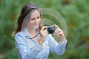 Lady looking at display on digital camera