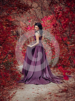 Lady in a luxury lush purple dress