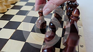 Lady making a first move in chess, opening gambit. Woman leadership concept.