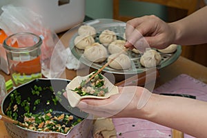 Lady making traditional chinese bun
